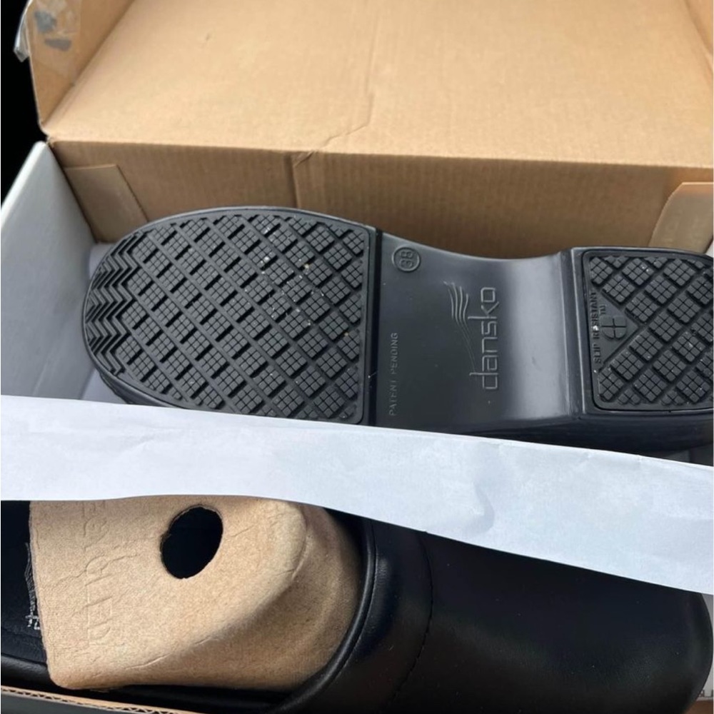 Dansko clogs . Only worn for five mins : haha